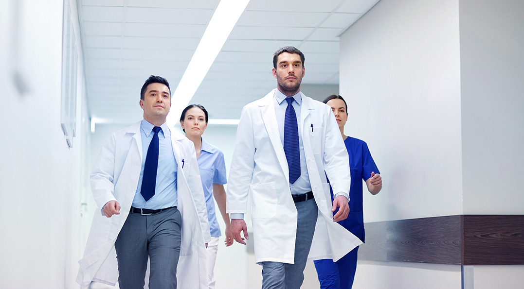 group-of-medics-walking-along-hospital-P92EJ7V-1.jpg